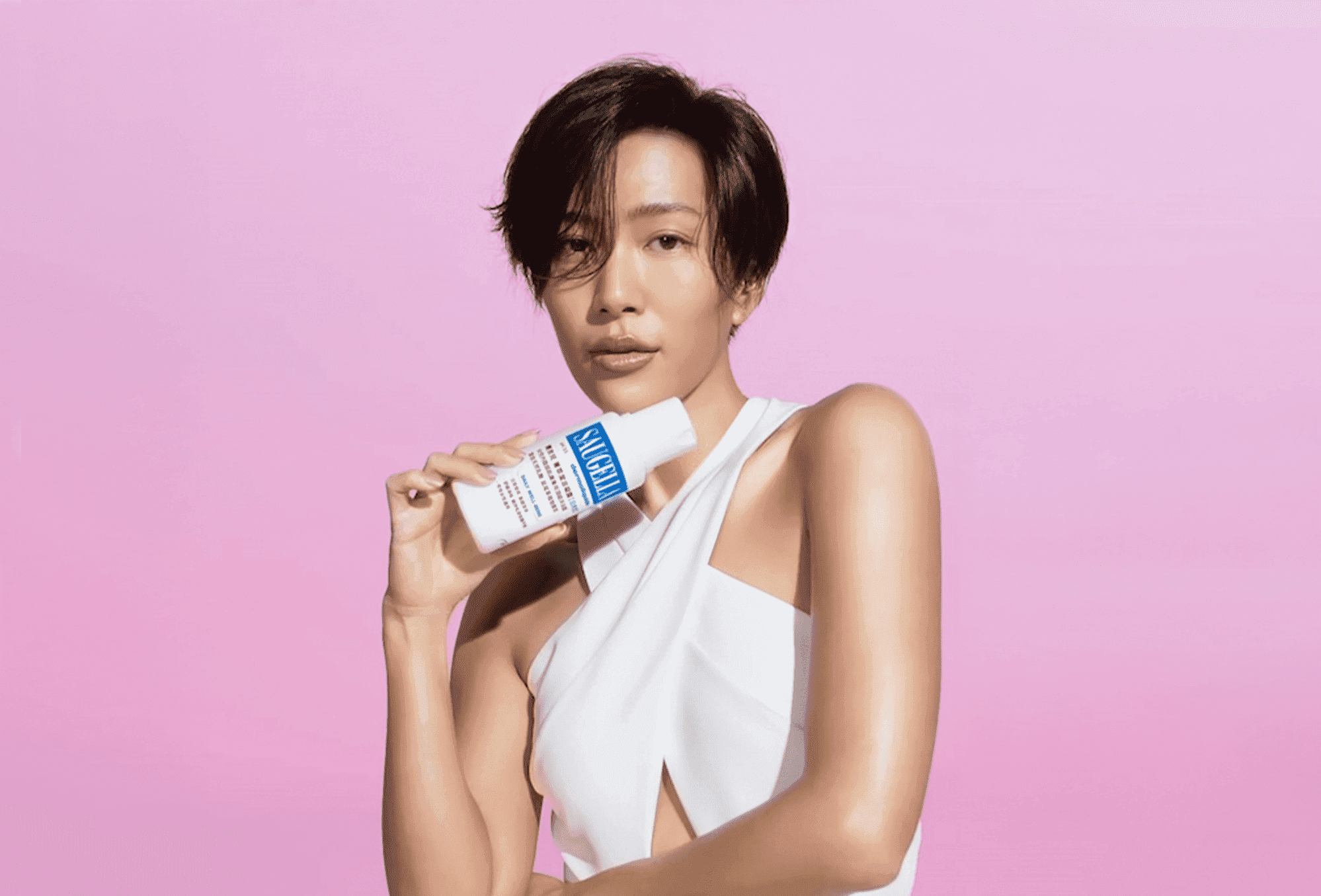 Two moose in a field of sagebrush at sunrise.