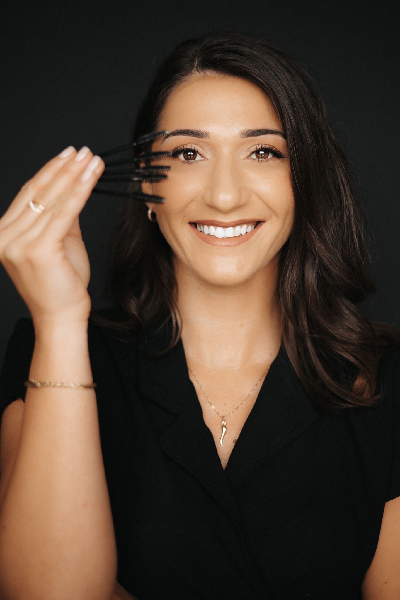 Beautiful girl standing near tree foliage