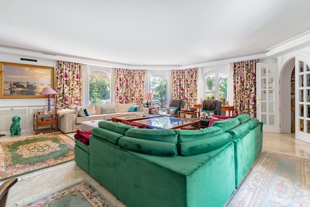 Spacious and elegantly designed living room in the luxurious 5-bedroom villa, showcasing modern decor and natural light.