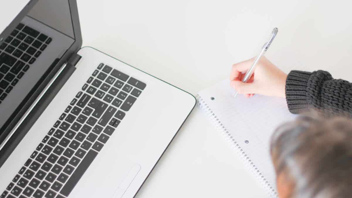 person writing - Can You Use I In A Research Paper