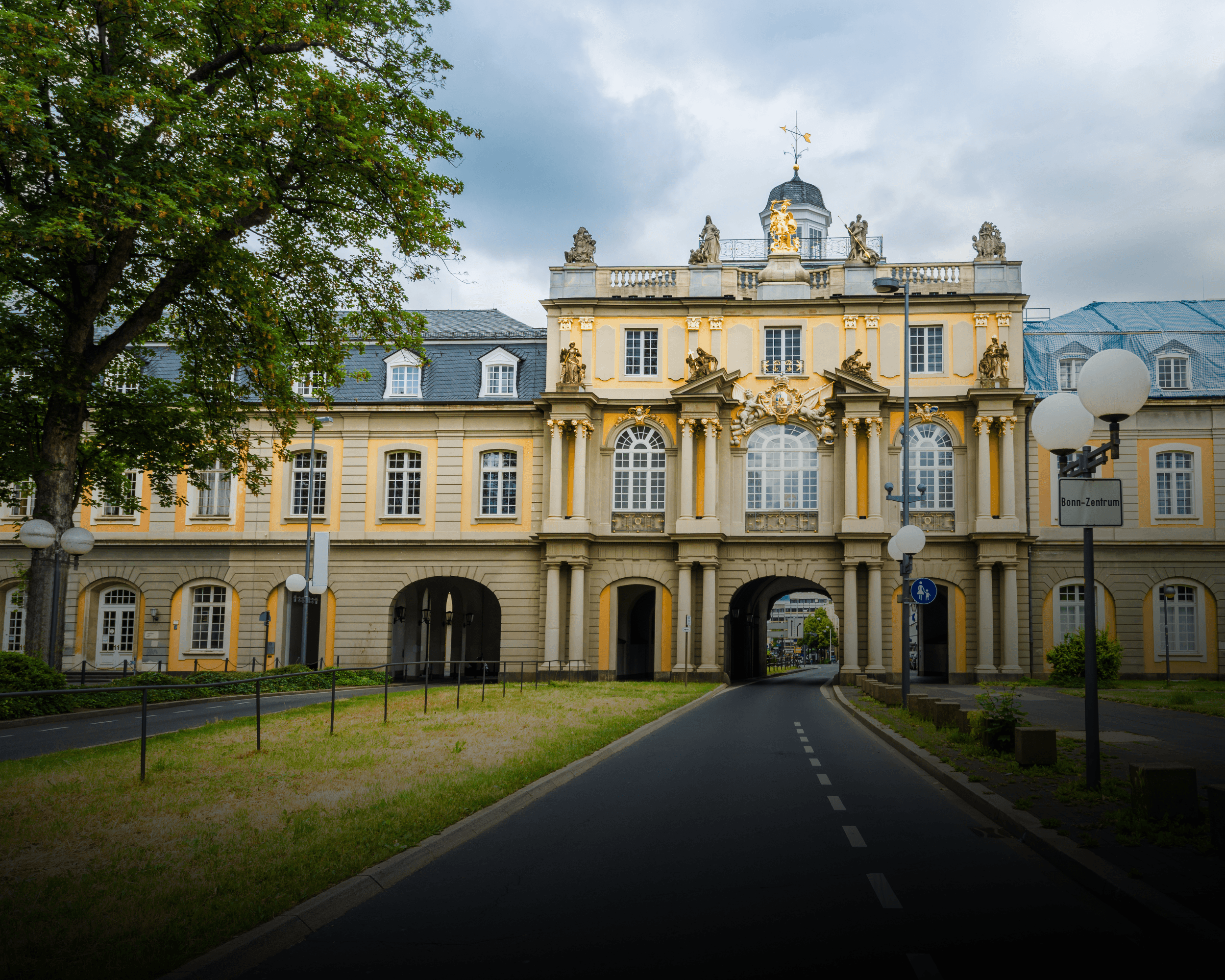 two people looking at a tablet and smiling