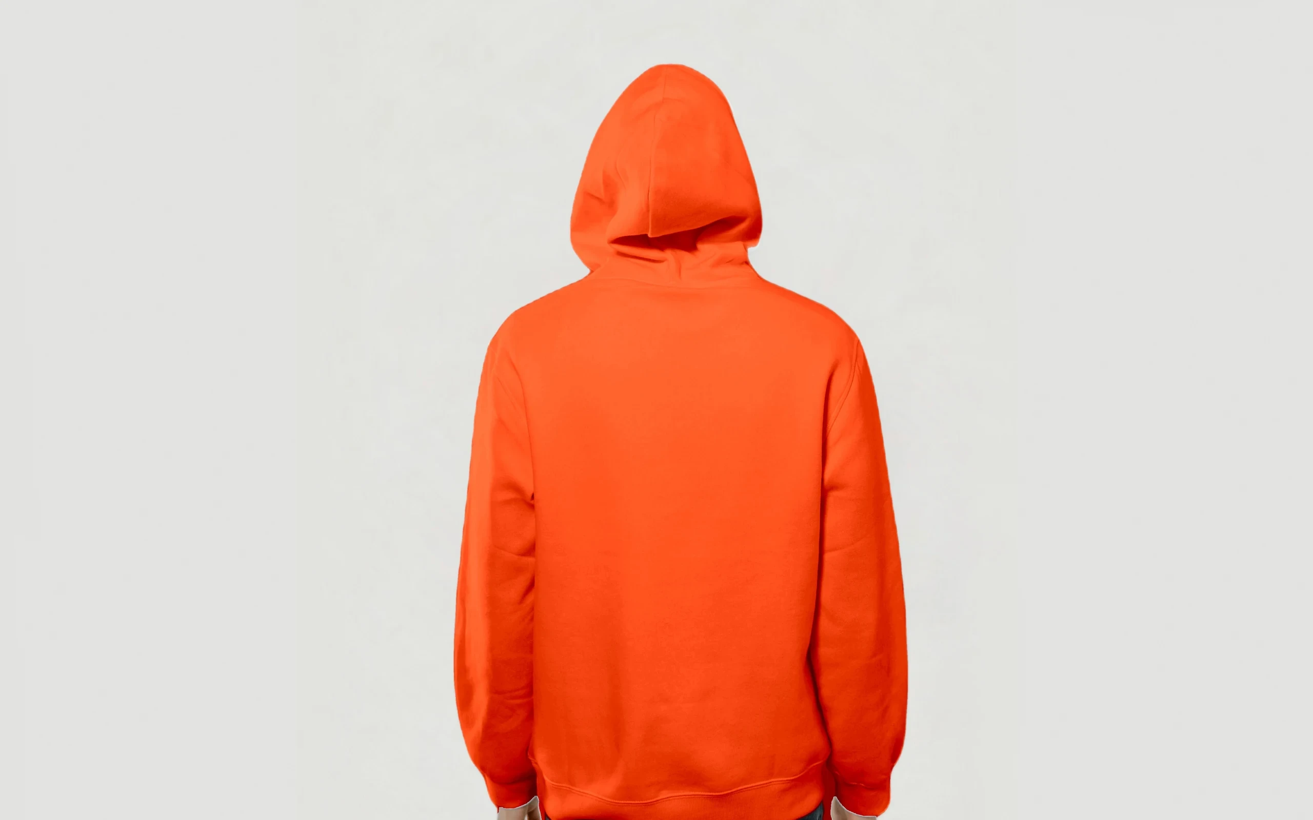Model from behind in the Heavy Hoodie, Signal colourway