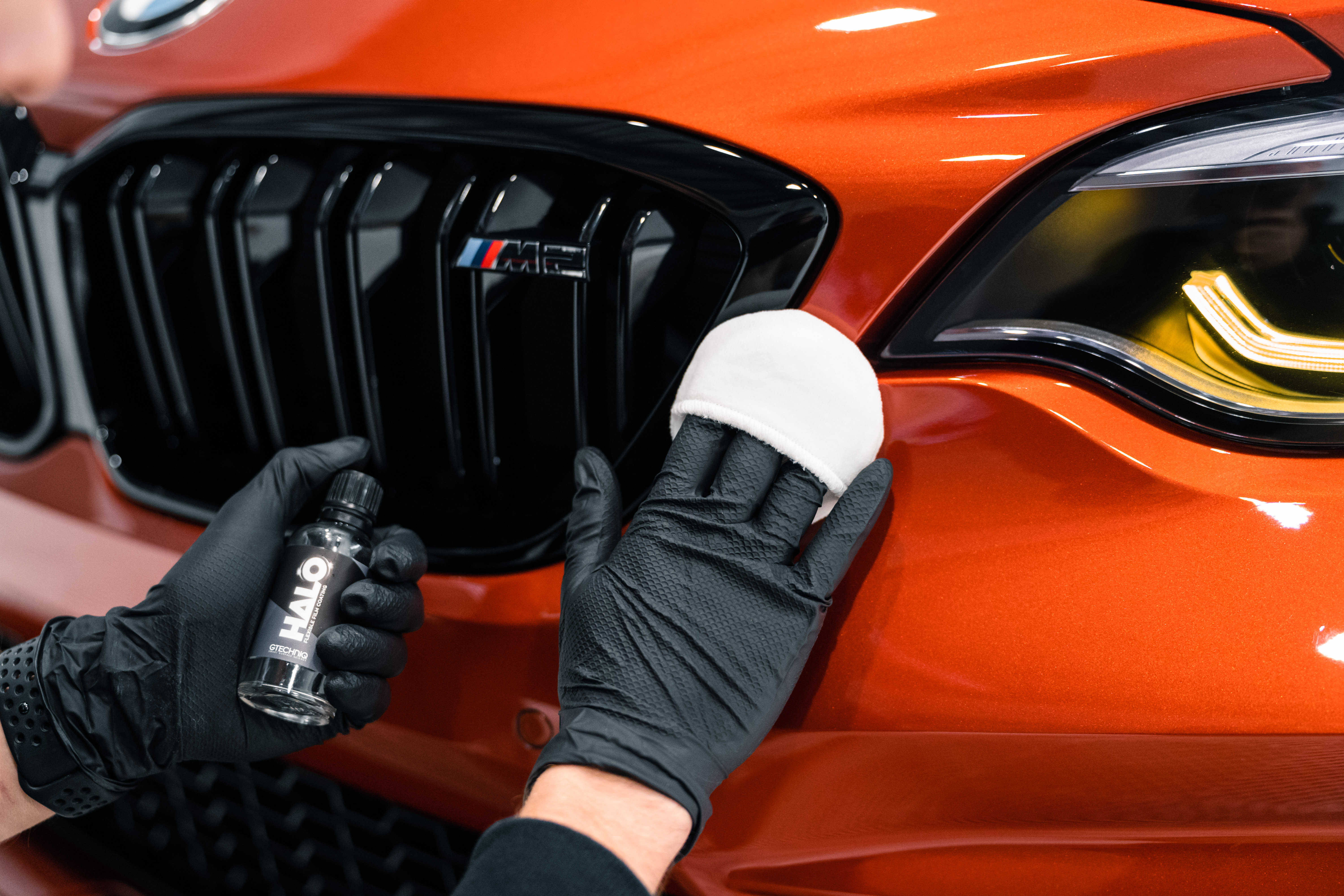 Red sports car with glowing taillights, motion blurred