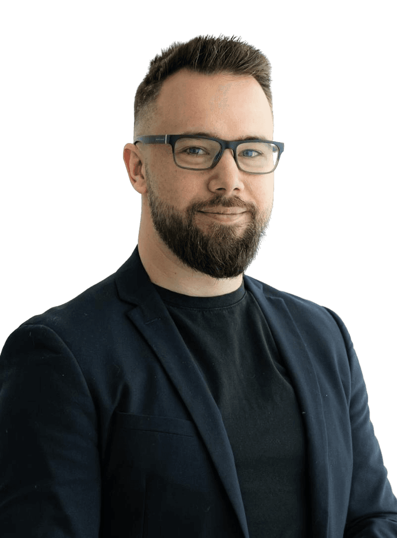 man standing near white wall