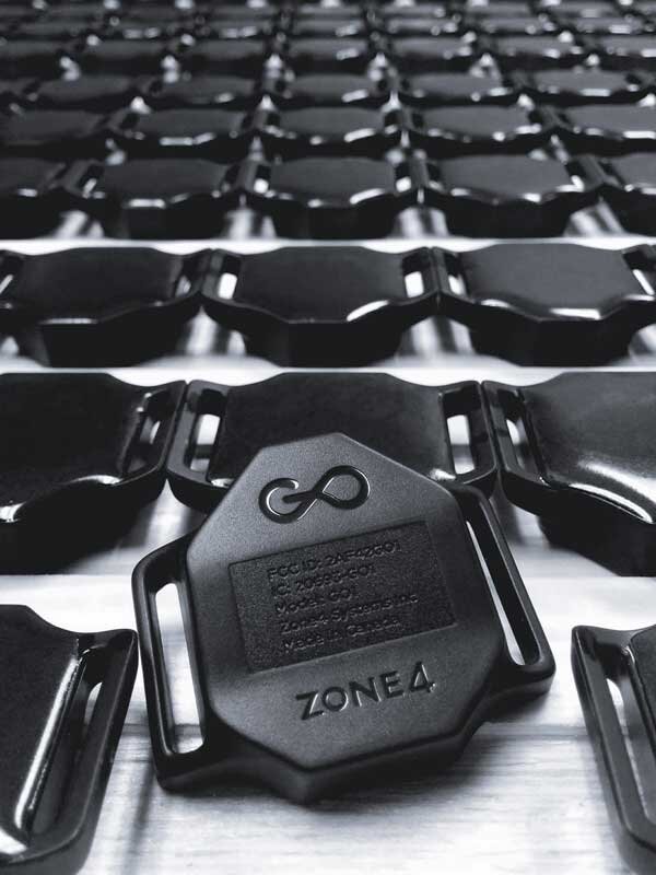 a black race timer with a bunch of race timers behind it  