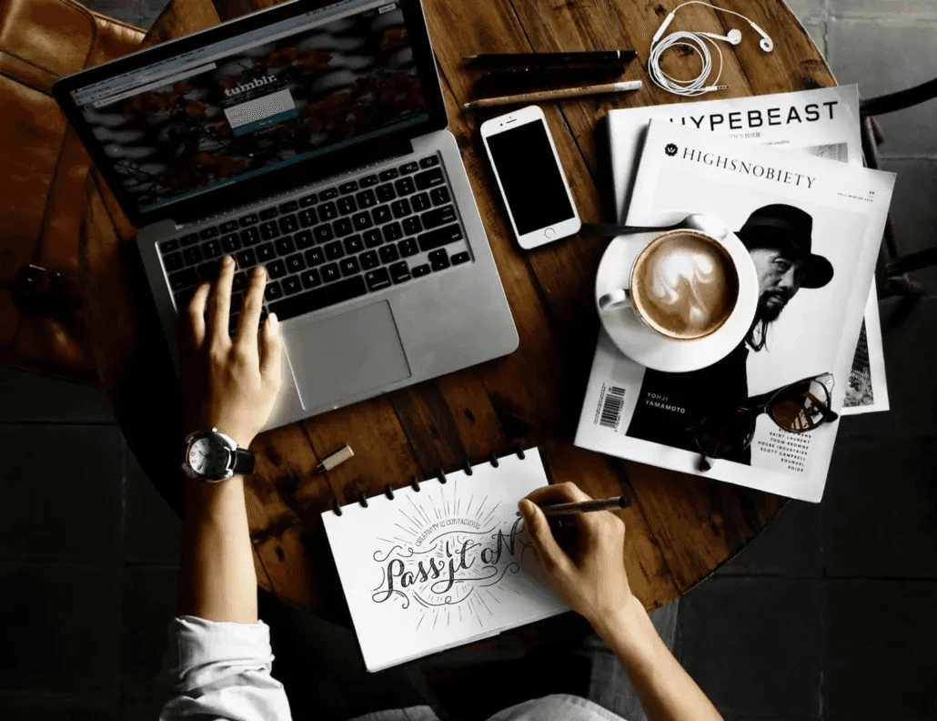 Overhead view of creative workspace desk setup - Types Of Creativity