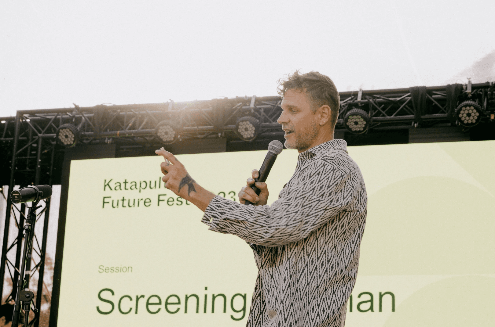 A speaker standing on a stage at Katapult Future Fest.