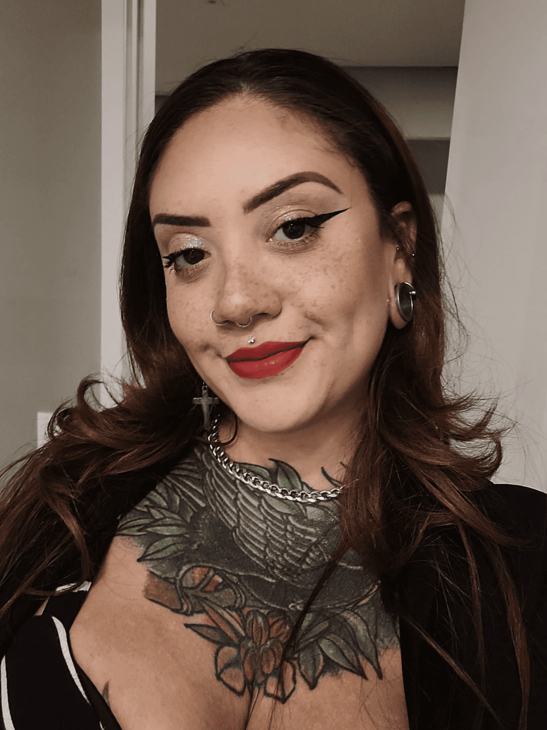 Sara is a client smiling to the camera happily