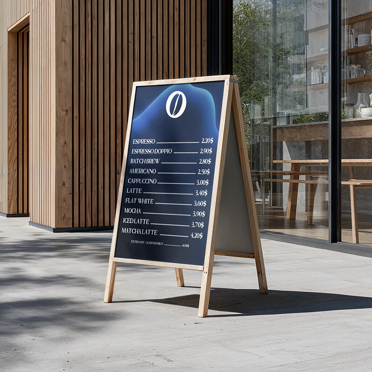 A modern A-board coffee menu placed outside a café, showcasing espresso-based drinks and prices on a dark minimalist design.