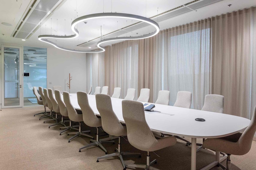 Photo of an office with chairs and a big table