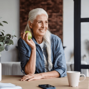 image of a women holding an apple