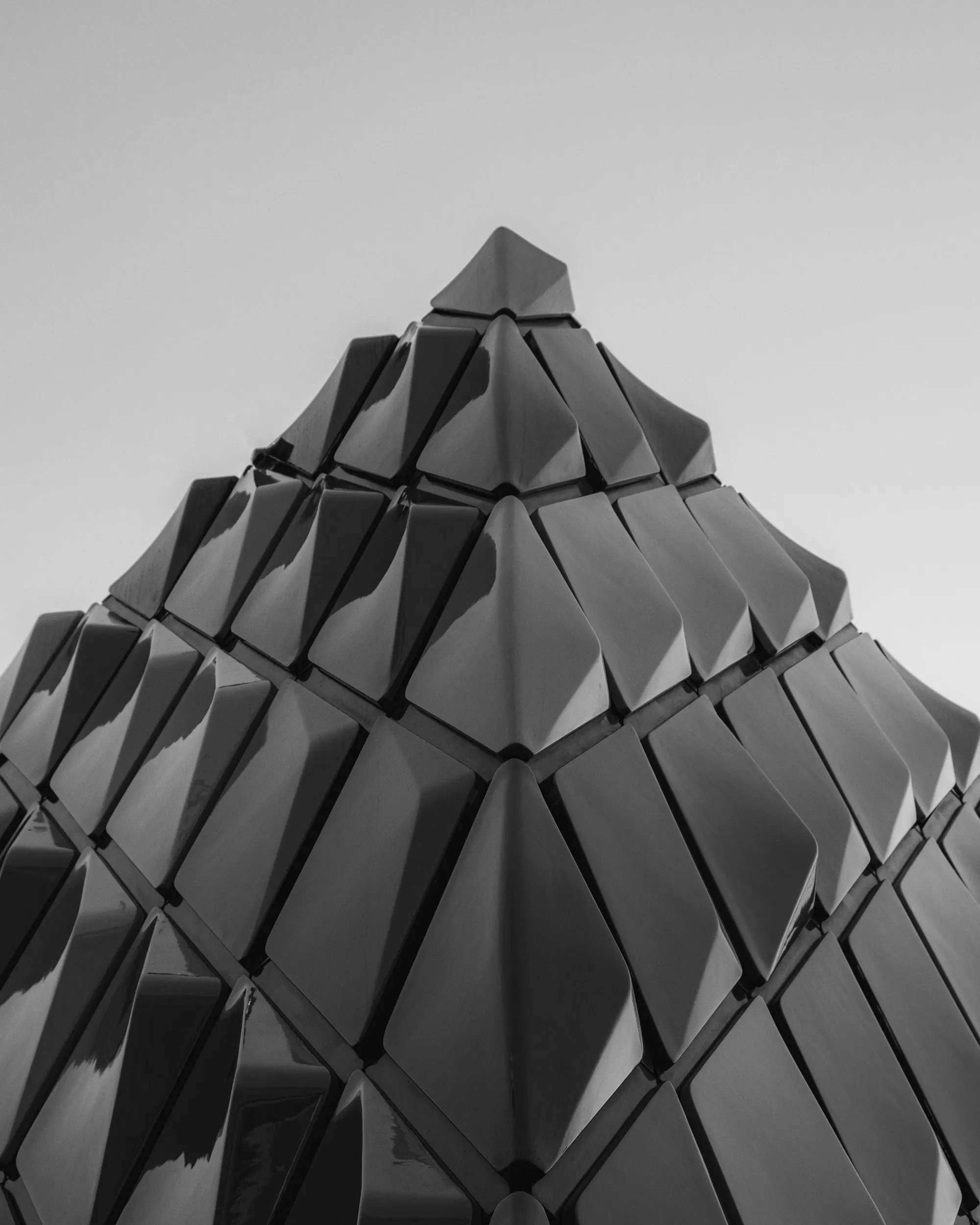 Monochrome geometric abstract sculpture with faceted surfaces, minimalist digital art