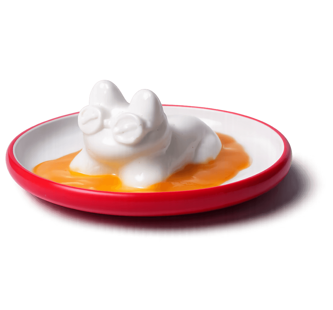 Kitty Cheng dessert shaped like a white cat in orange sauce