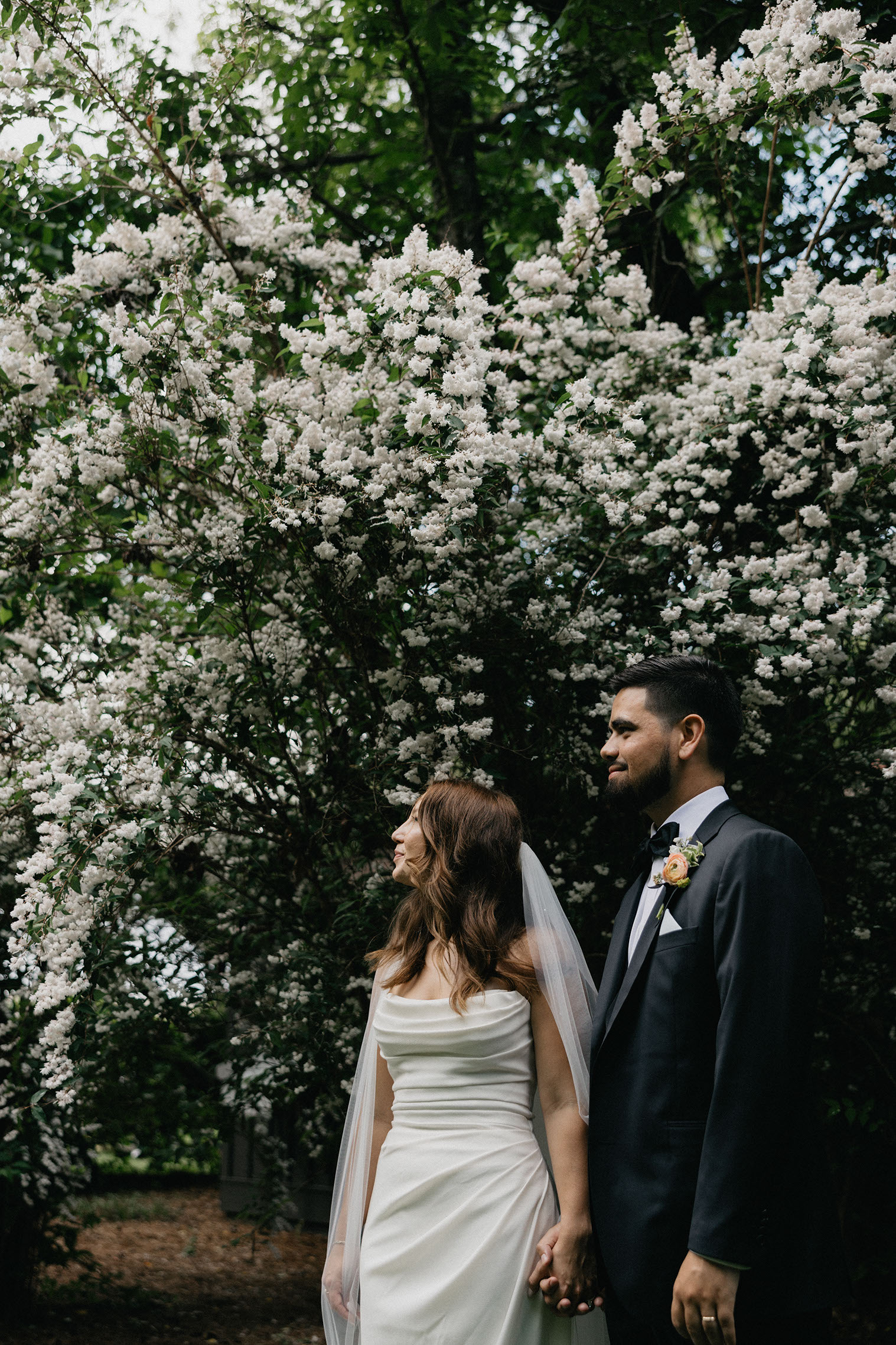 Bride and groom standing beneath the floral-patterned ceiling of the bridal suite.