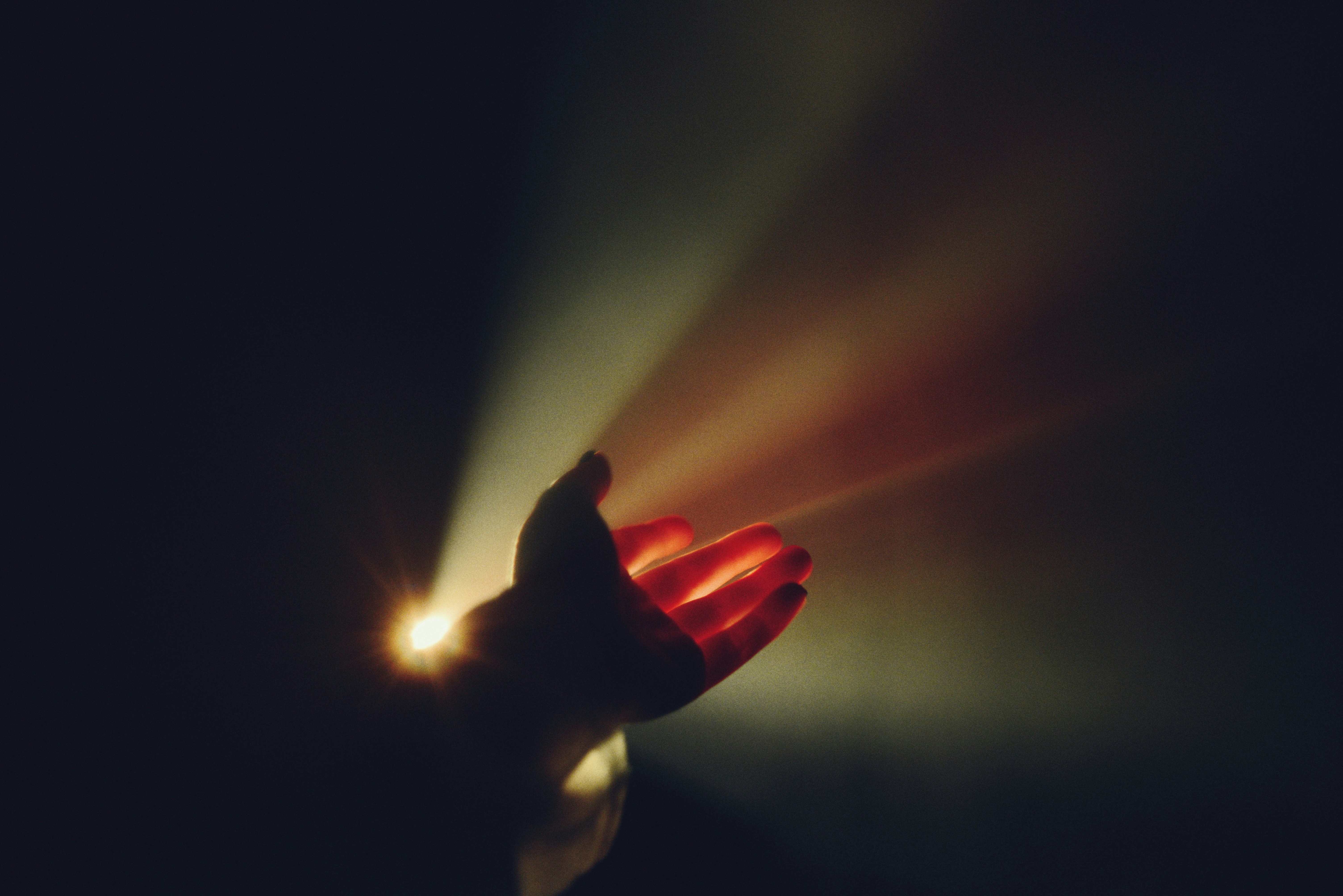 person hand in a dramatic lighting