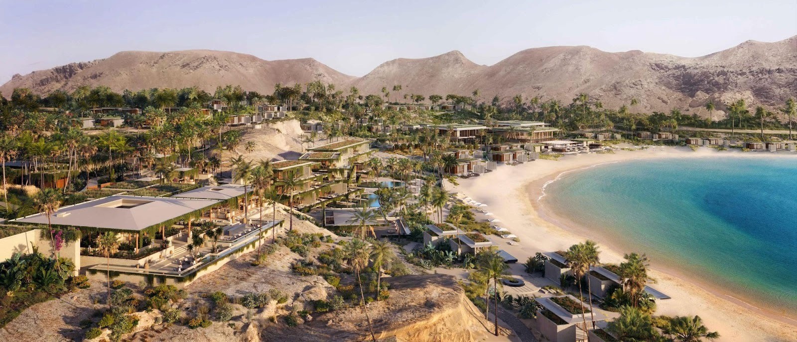 مشهد لمنتجع أمالا الفاخر محاط بالنخيل والكثبان الرملية والمياه الفيروزية، يعبر عن السكينة والجمال الاستوائي الذي تحرص شركة البحر الأحمر العالمية على إبرازه.