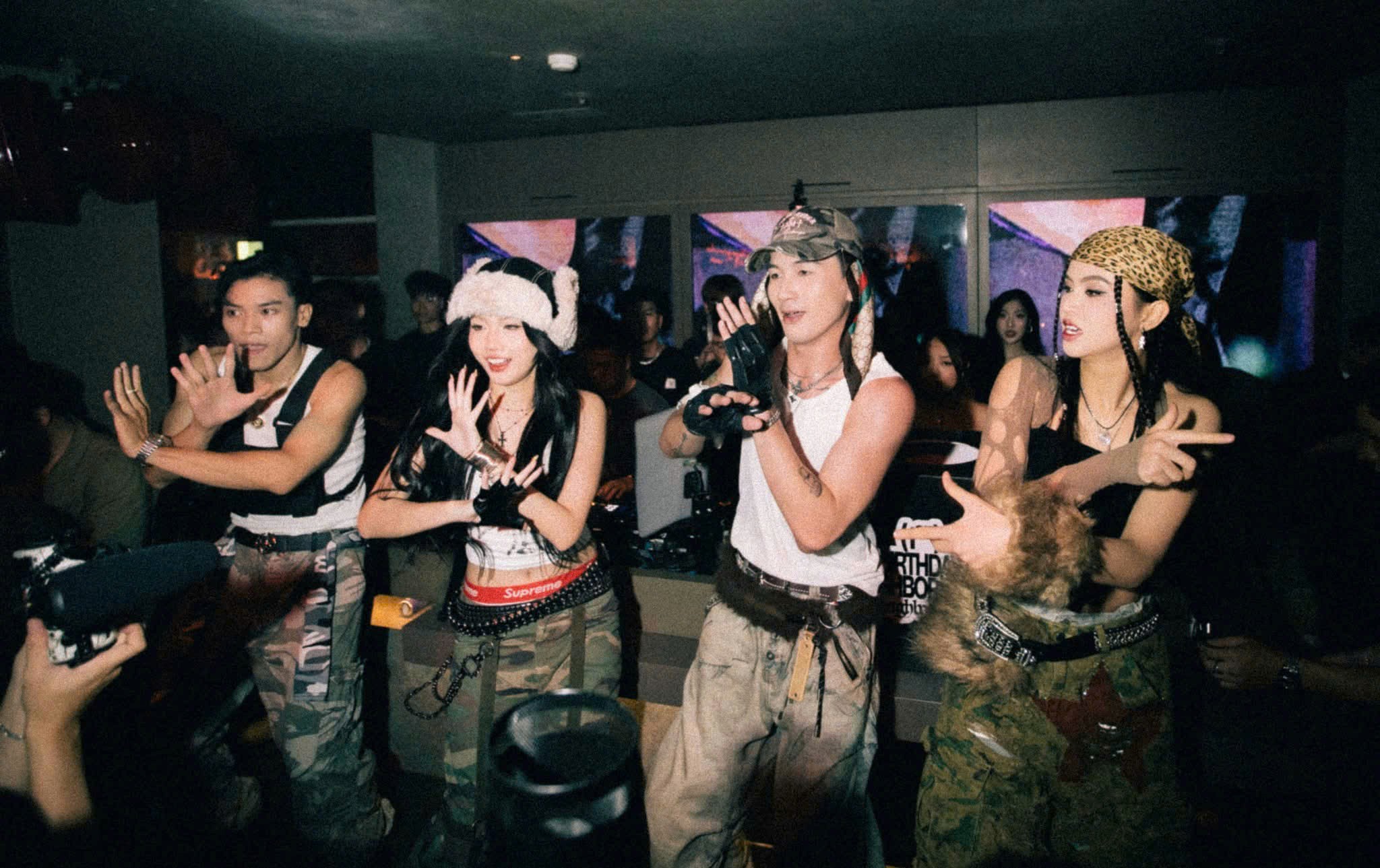 Neighborhood SGN Saigon nightclub scene with a streetwear crowd enjoying the house-party energy
