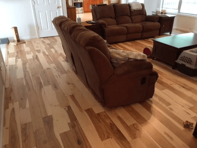 Beautiful hardwood flooring in a living room by Shilling's Carpets & Floors