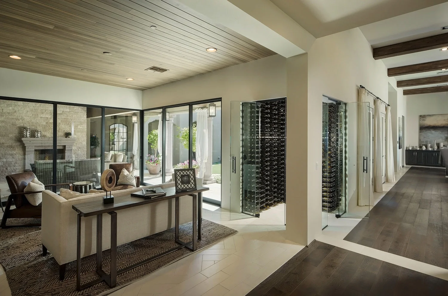 nfinity pool blending into the ocean view, minimalist sun loungers in soft neutral fabric, curved architecture