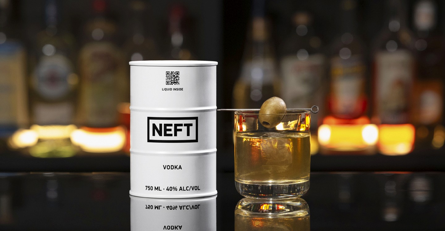 A NEFT Barrel and a glass of Dirty Double on a bar counter.