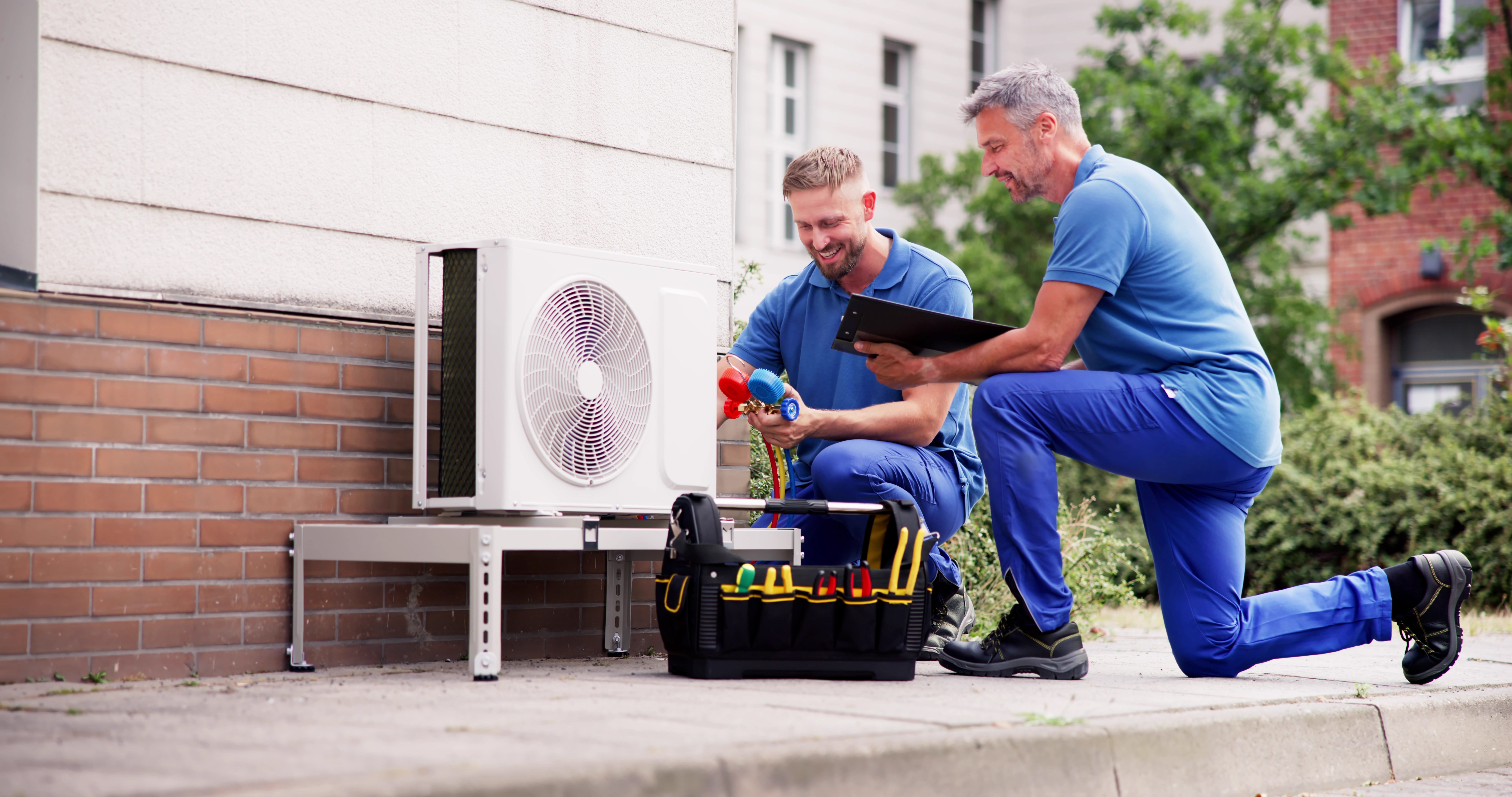 heat pump engineers installing a heat pump