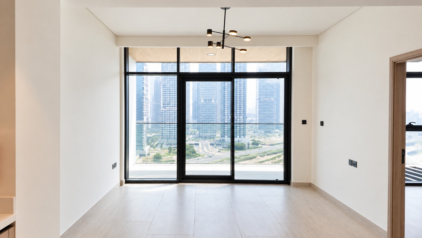 Empty living room on handover, bare floors and blank walls