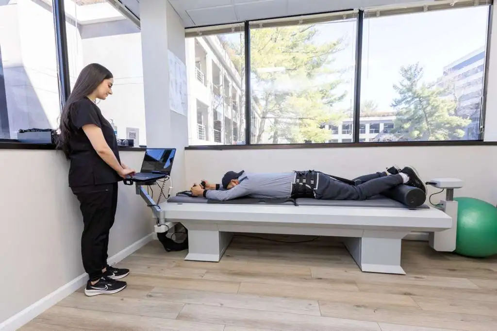 A man laying in a bed next to a woman