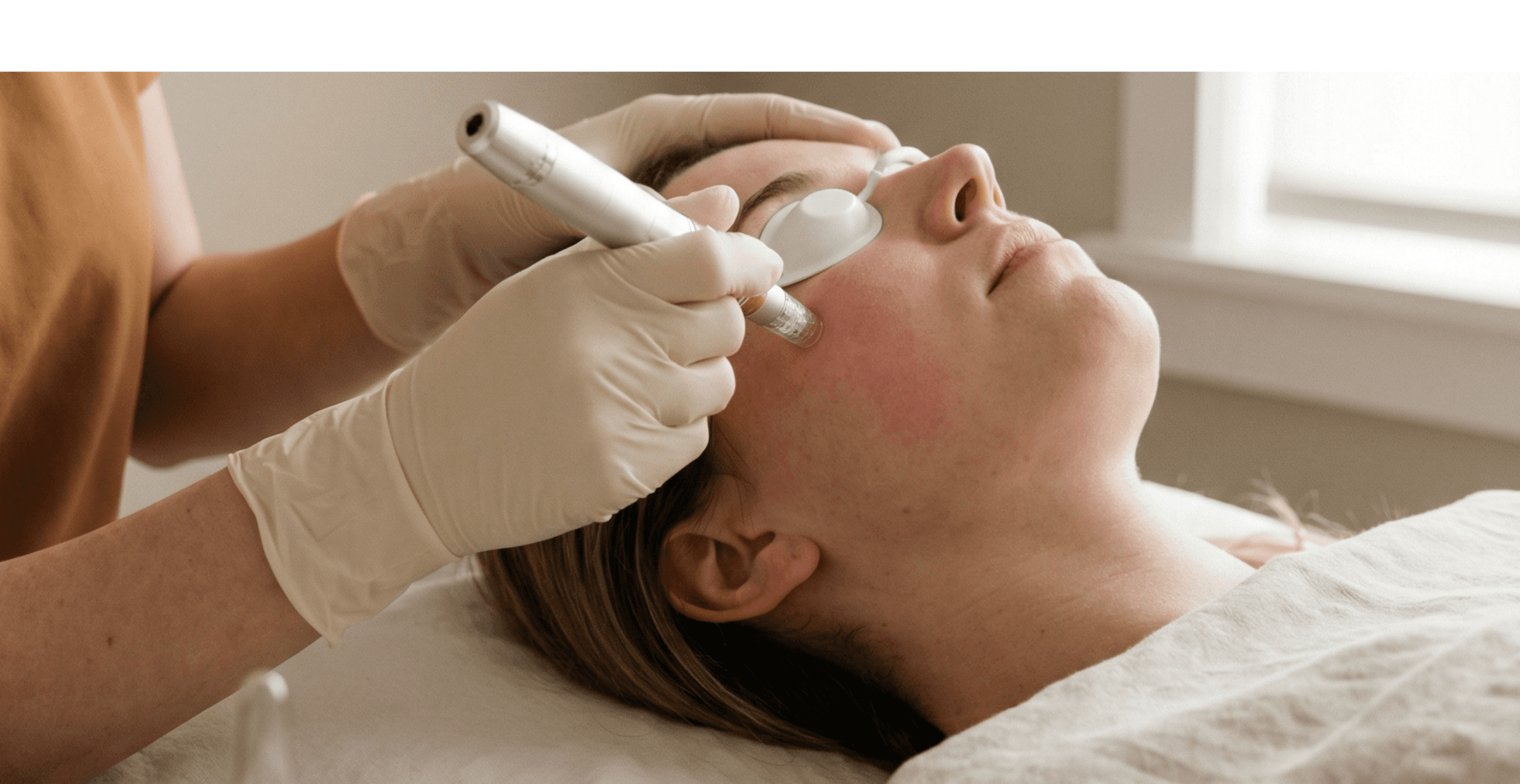 Woman relaxing during professional facial treatment at Nuvita Regen Center medspa, showcasing rejuvenating skincare and wellness services in Los Angeles.