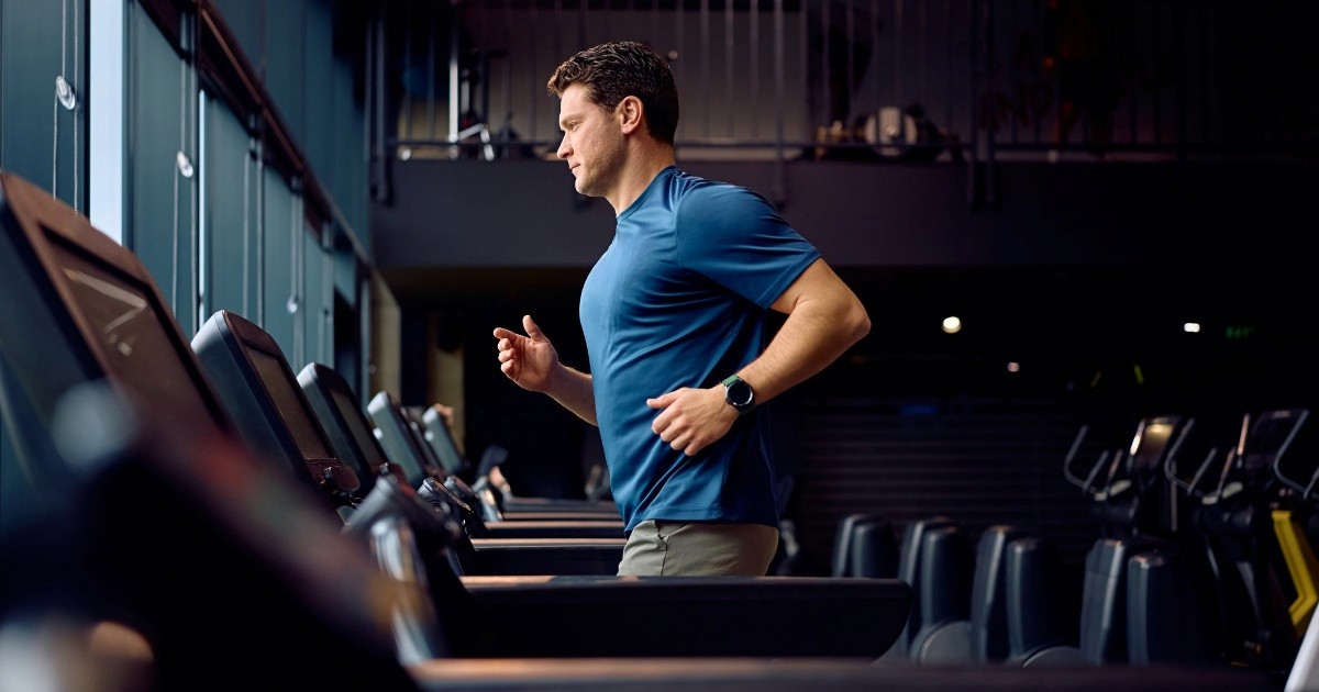 Fit and healthy man running on threadmill