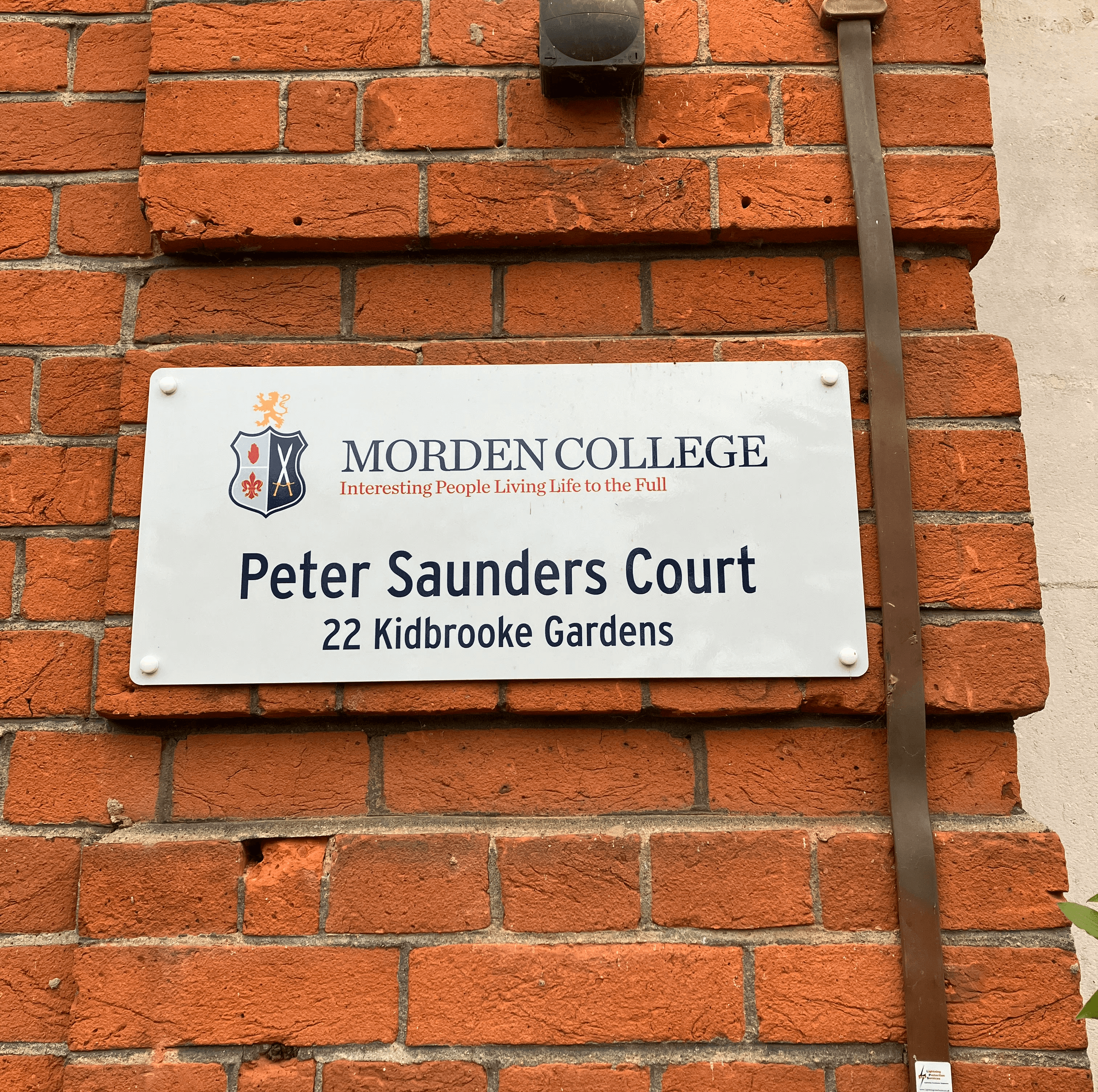 A digger inside a warehouse under construction