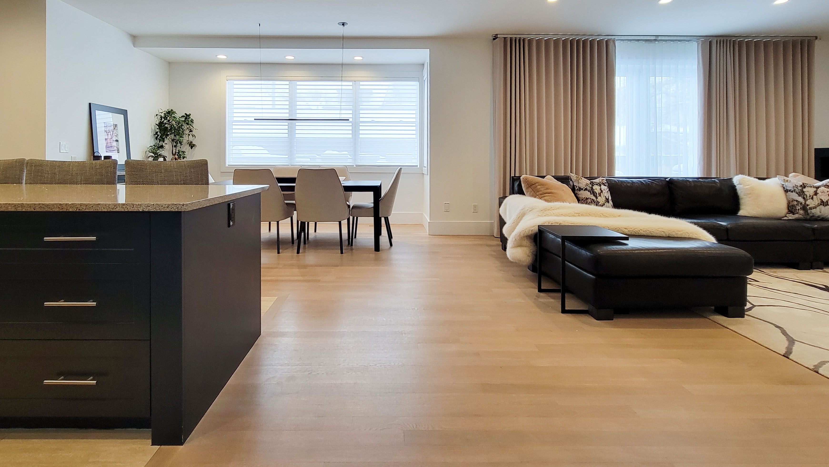 Image of Luxury living room and kitchen interior design by KHD Homes, featuring modern furniture and layout design.