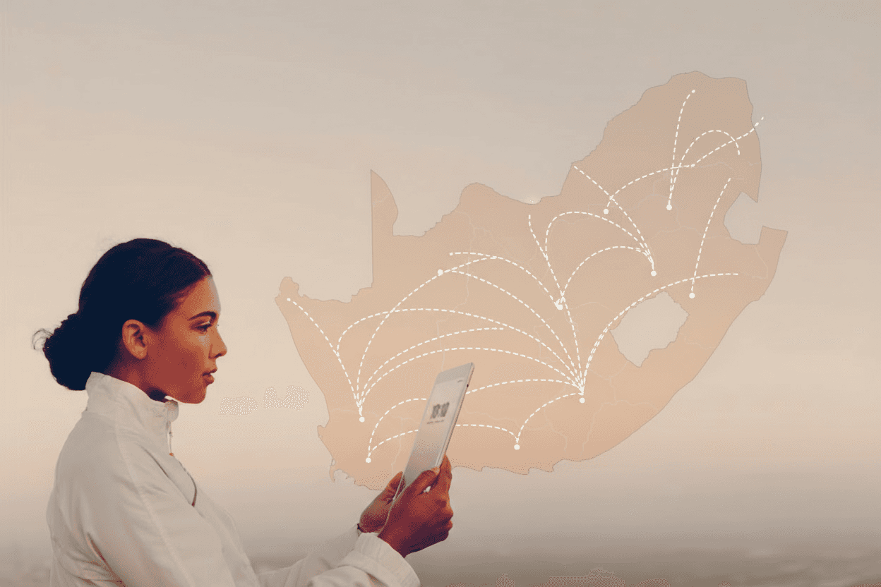 Professional woman holding a phone over a map of South Africa for Voice Broadcast.