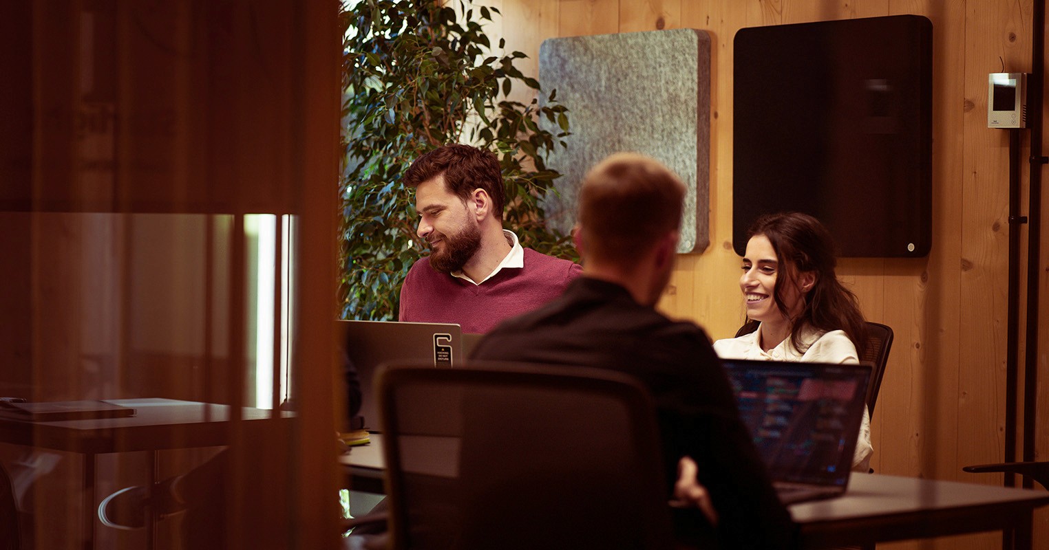 Colleagues laughing over a meeting