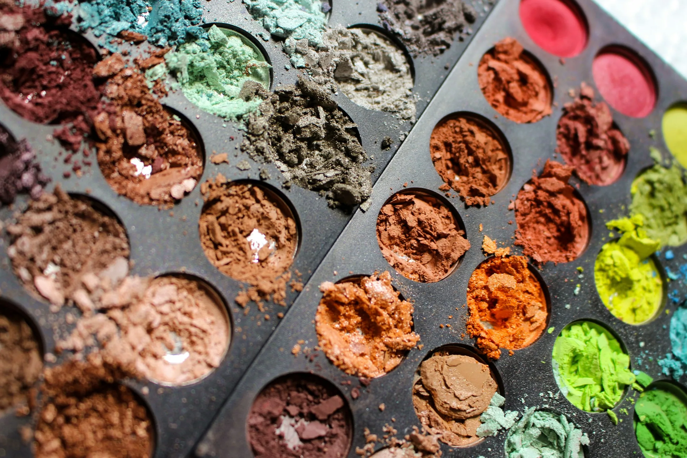 Crushed eyeshadow pans in a palette