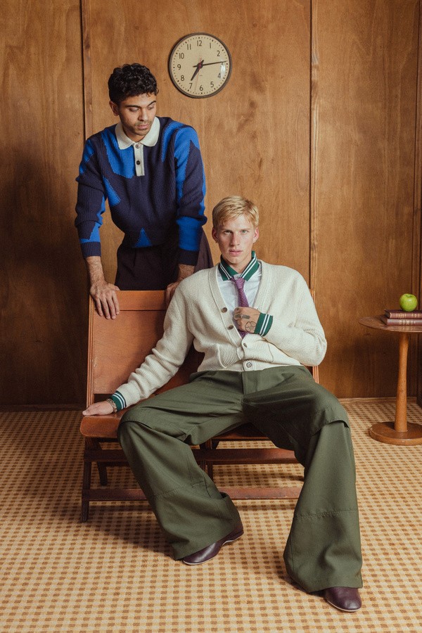 sitting on a chair posing for a picture