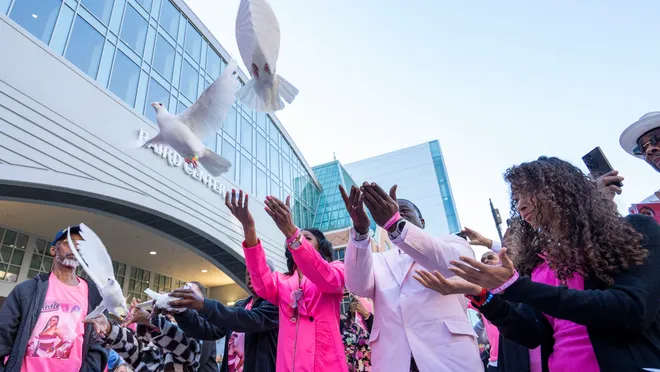 a black and white living room with a large tv