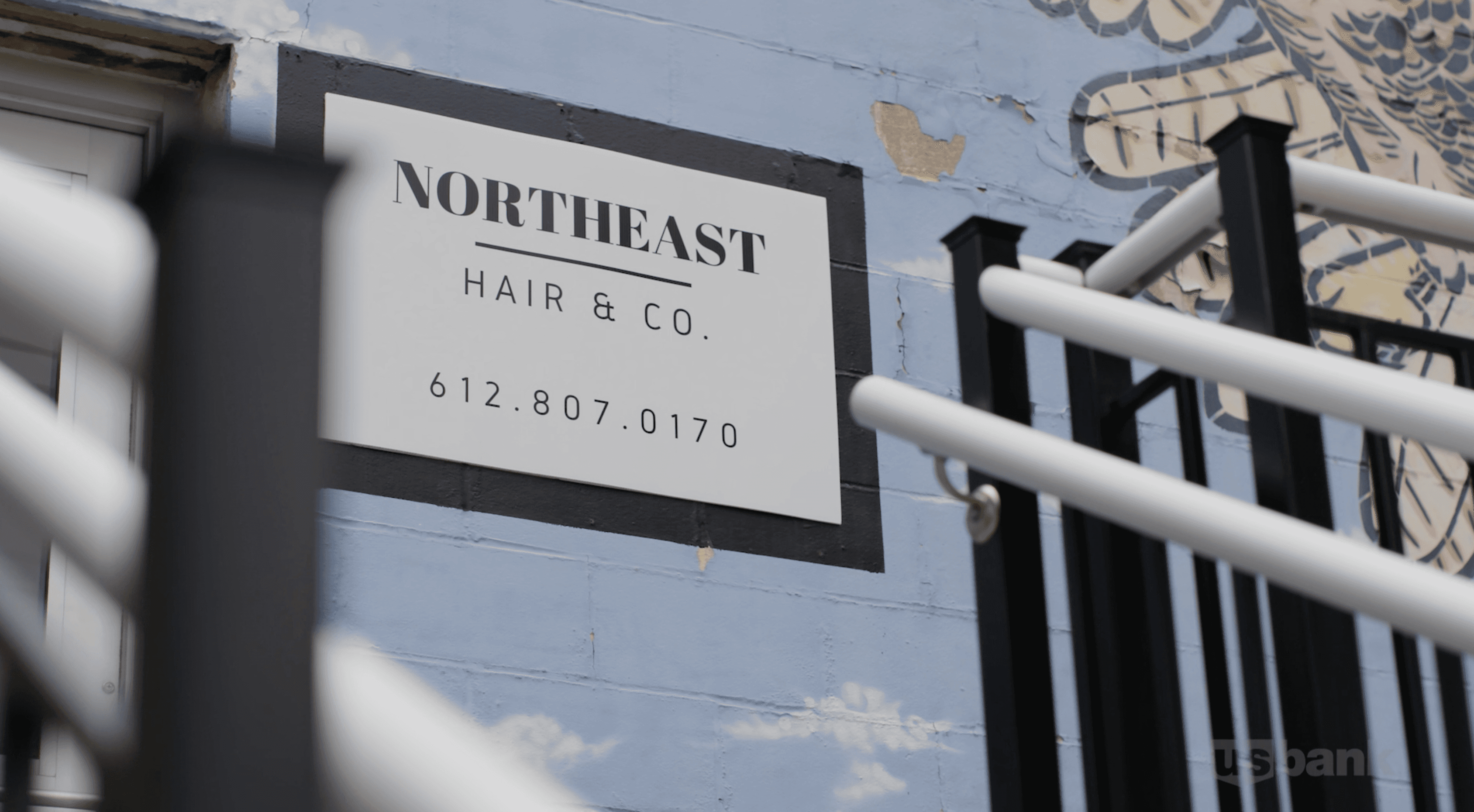 Northeast Hair Co's sign on the side of their building