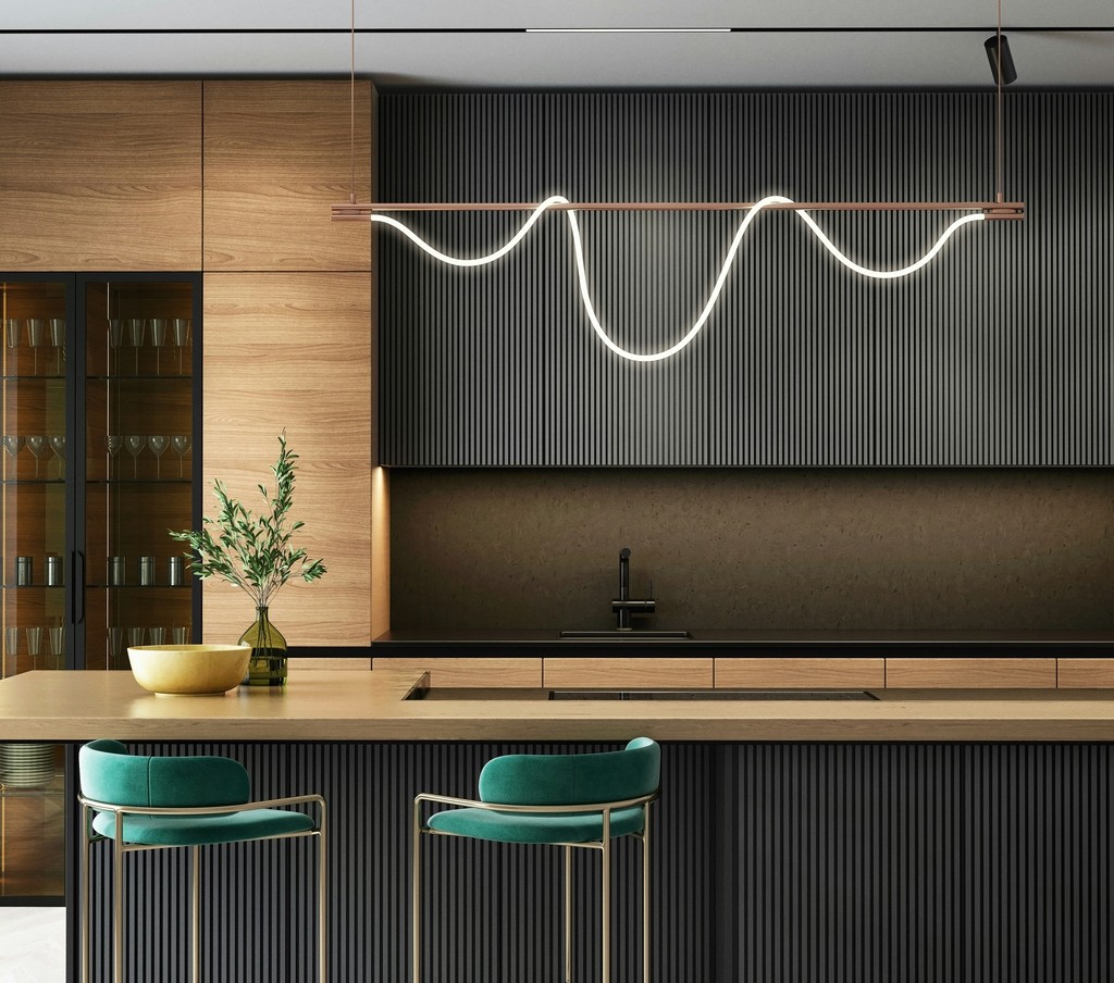 a modern kitchen with a bar and stools