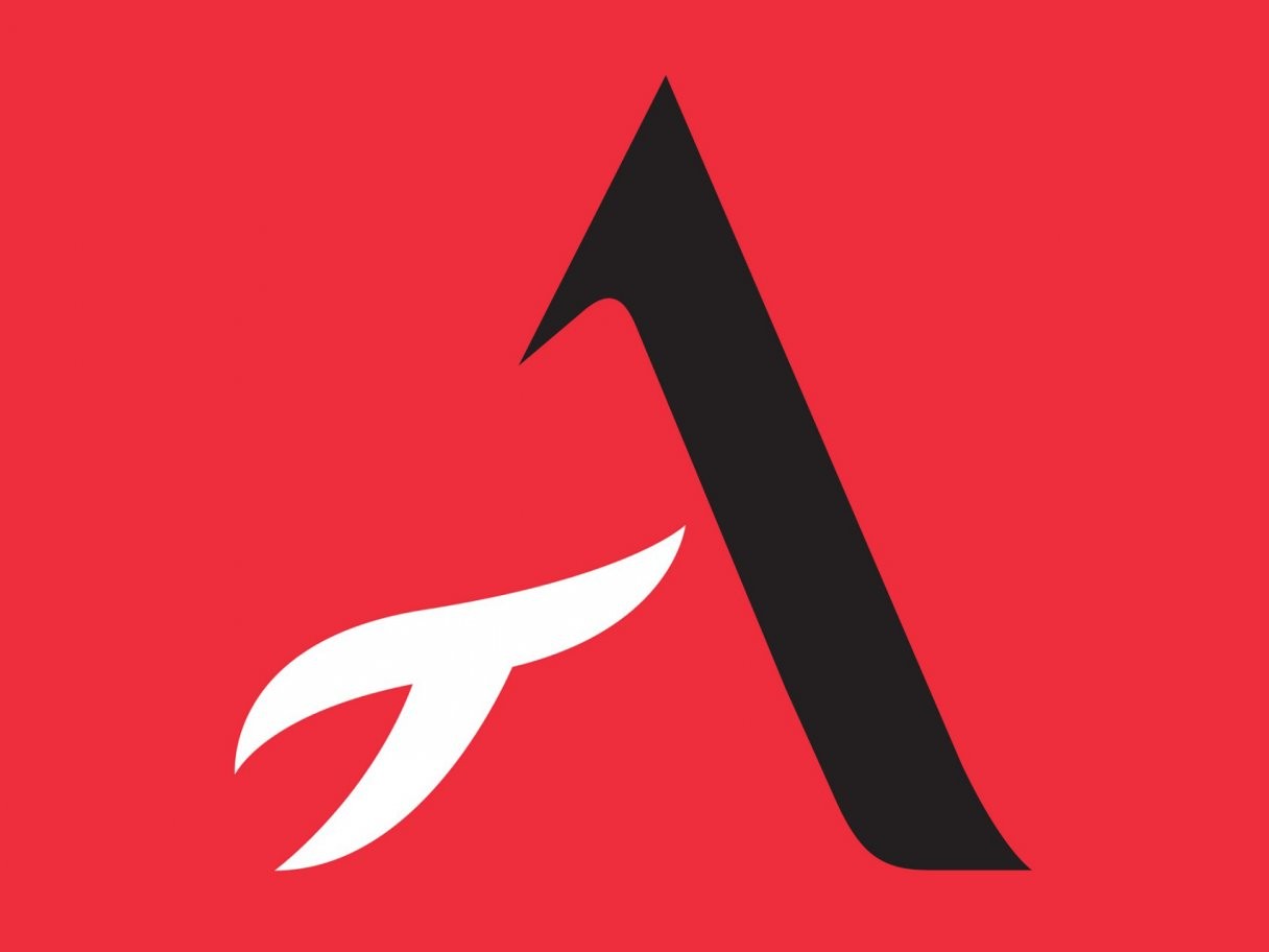 Rustic cabin in a golden field at sunset