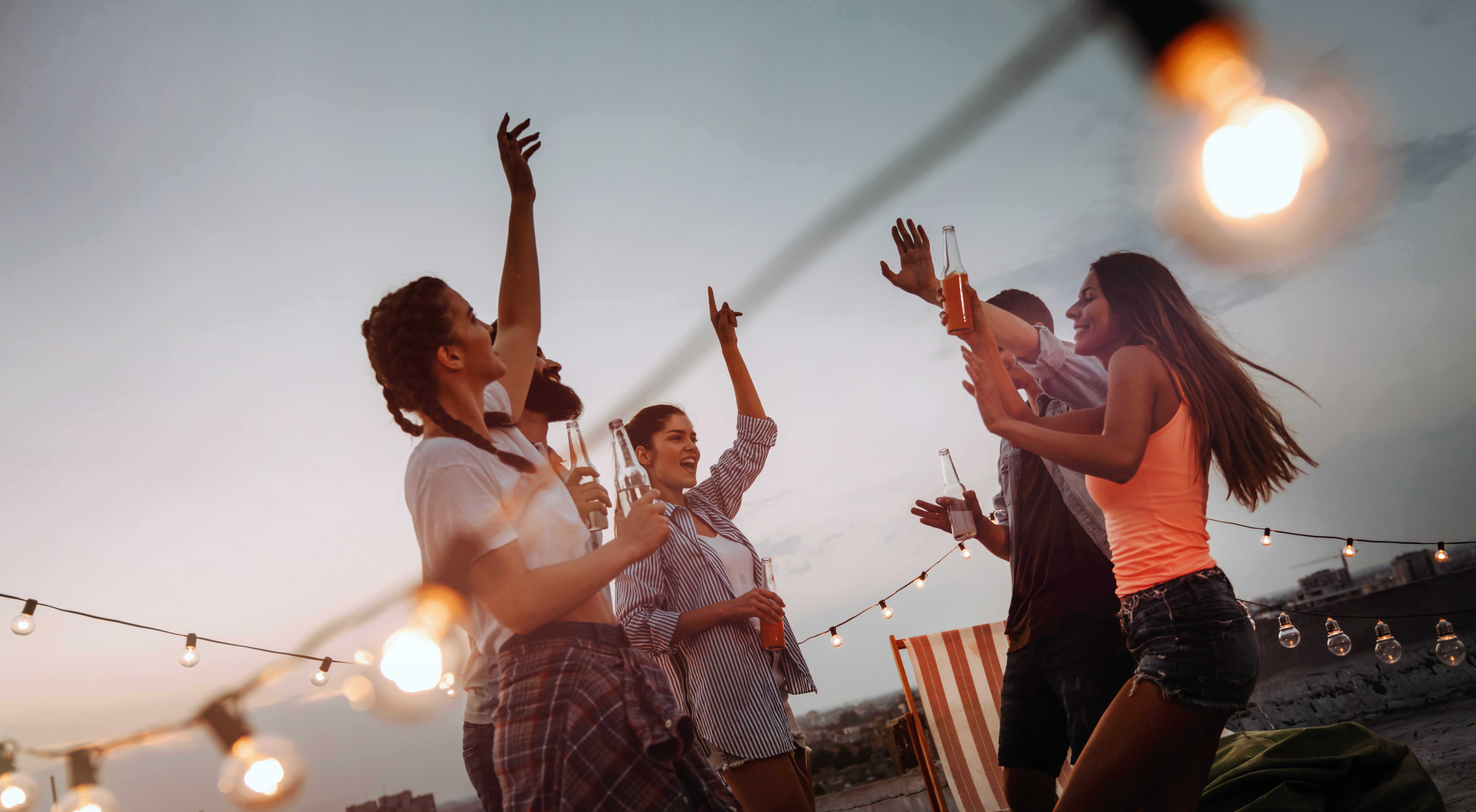kids lying on a glass land and smiling