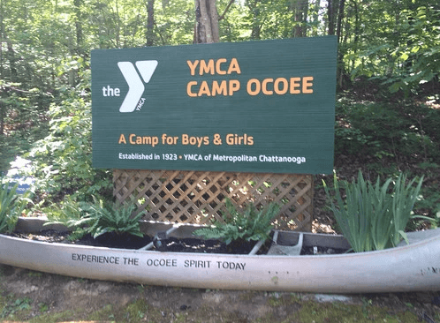 Camp Ocoee sign with canoe
