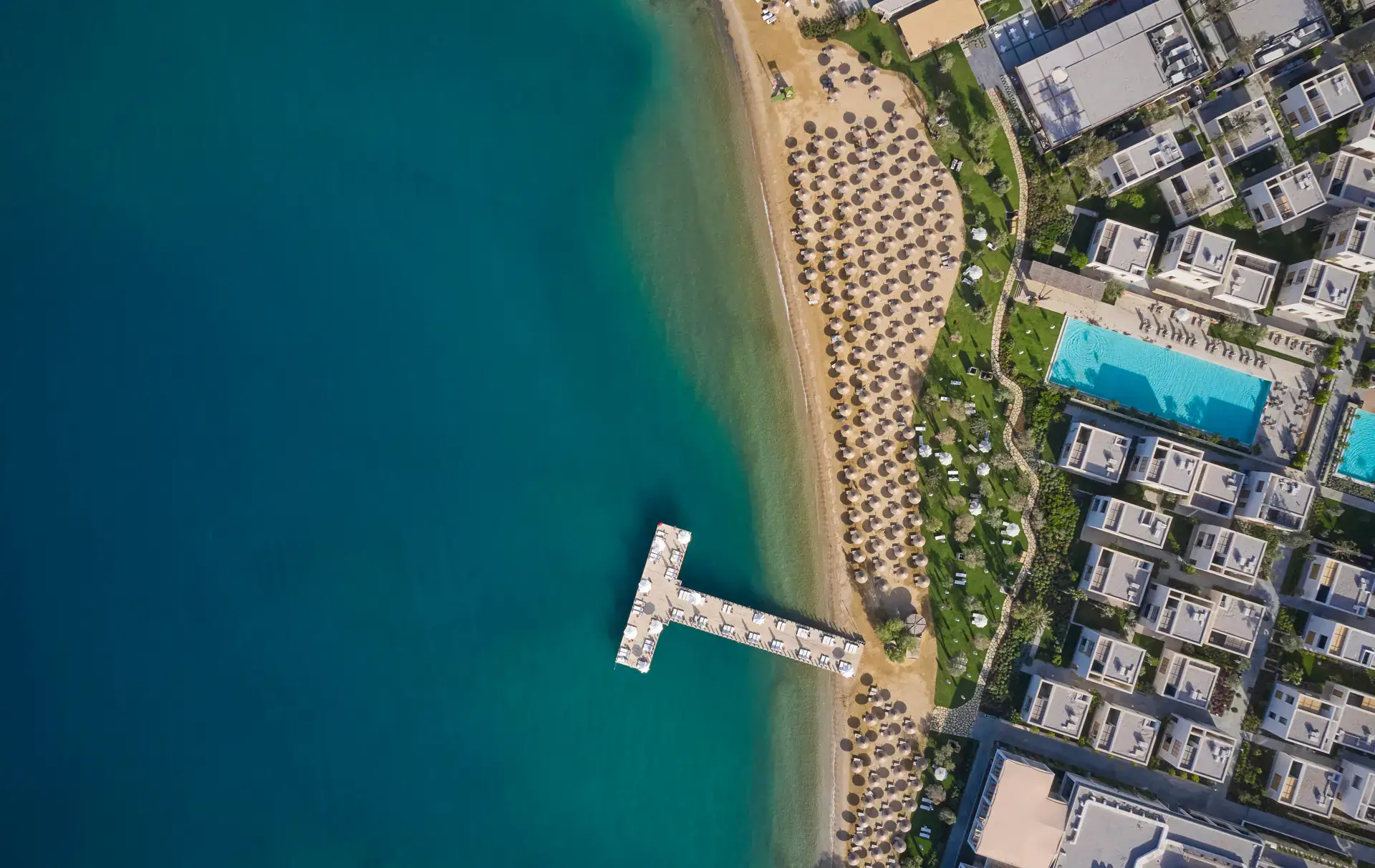 Top-down view of the beach, pier and buildings