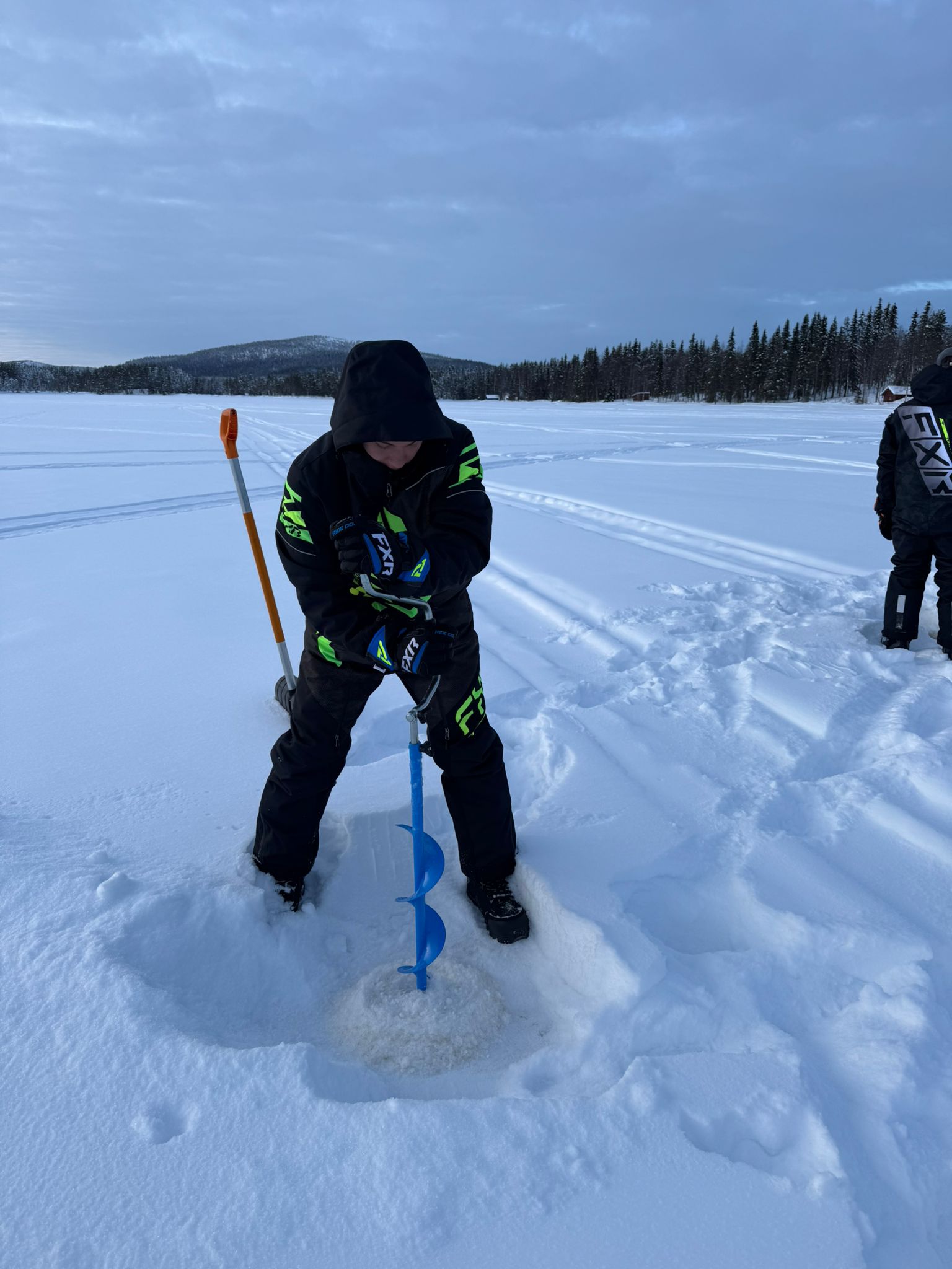 two people riding jet skis on a body of water
