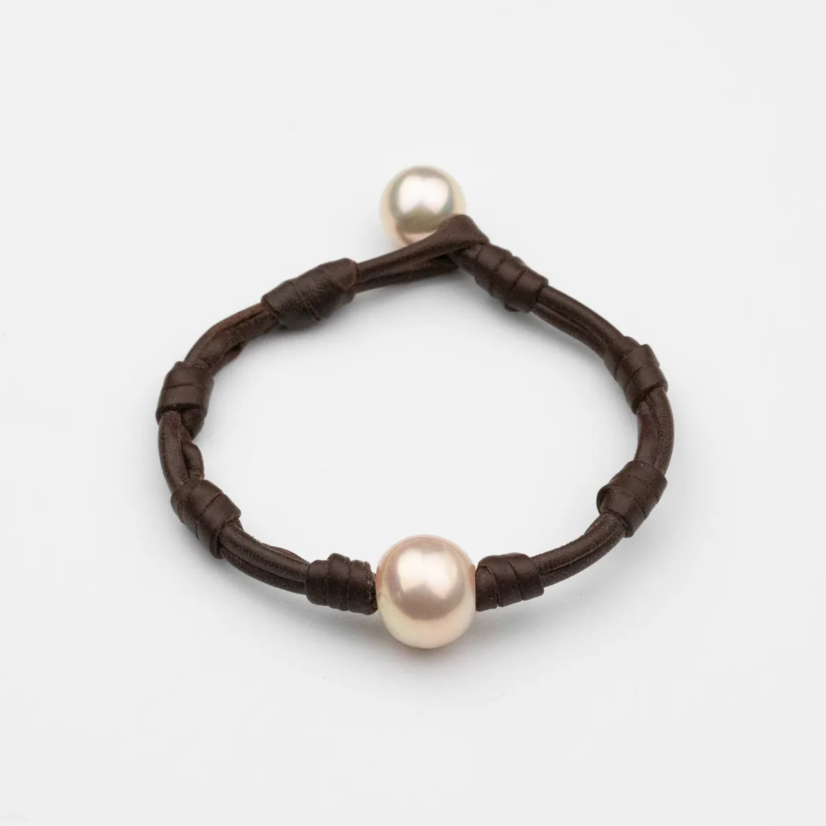 South Sea Pearl leather bracelet with hand-knotted dark brown leather cord and two round pearls — Manos de Oro Saint Barth