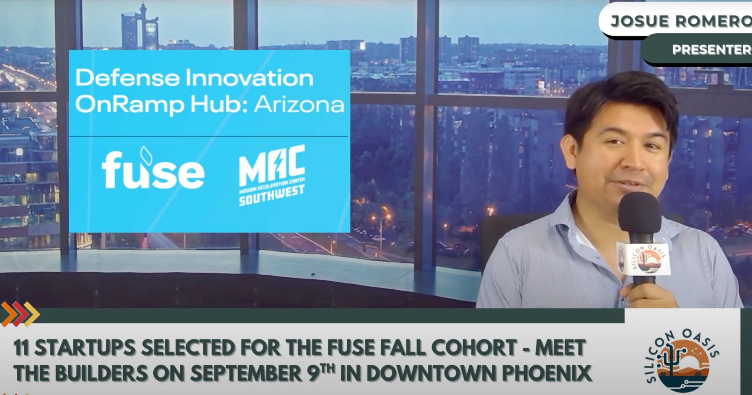 a black and white living room with a large tv