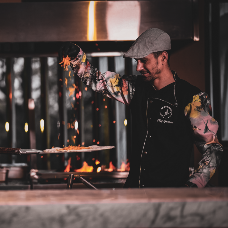 professional chef cooking pizza fire commercial food photography brand shoot