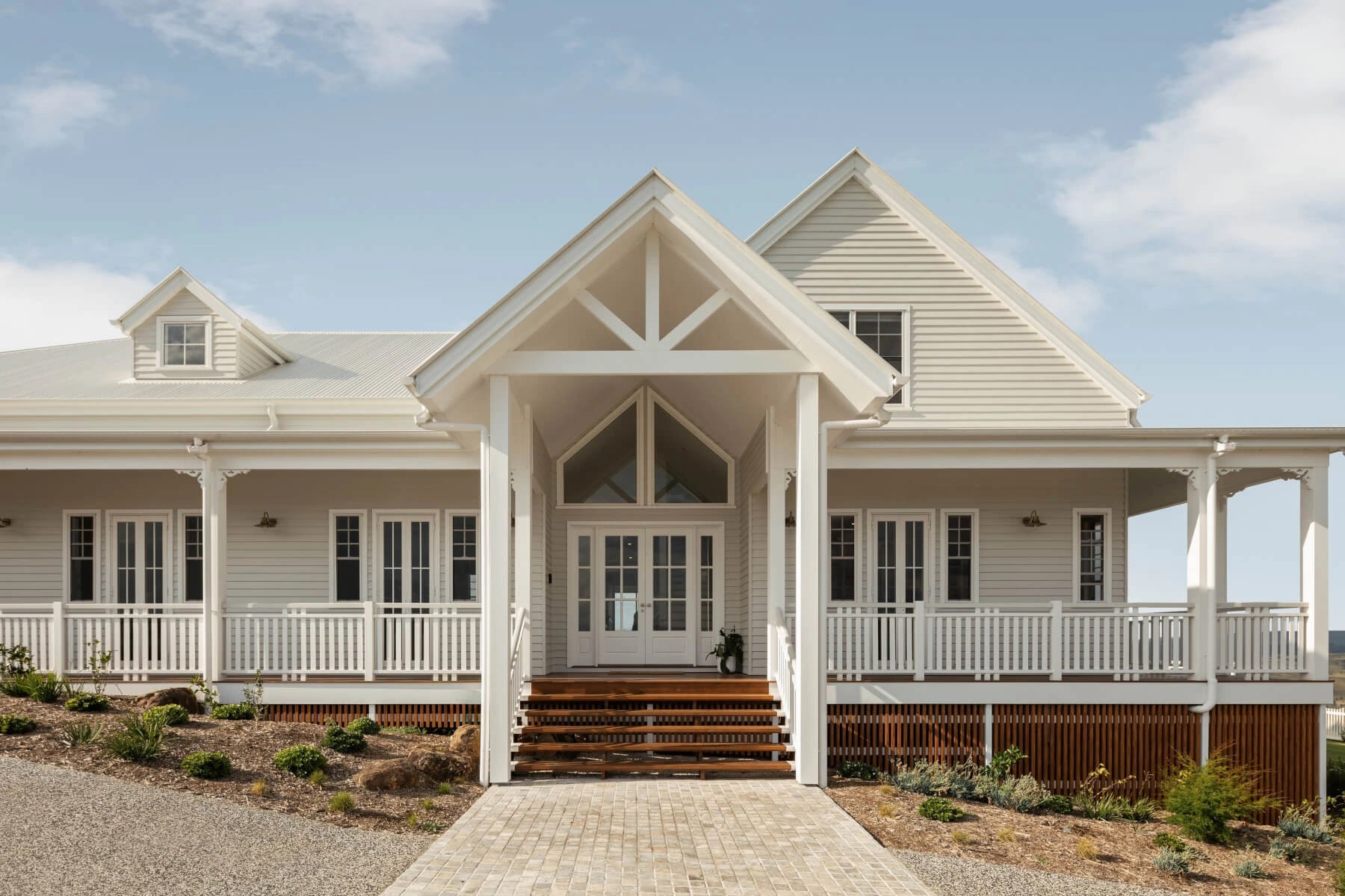 Illalangi front door designs and entryway showing different materials used