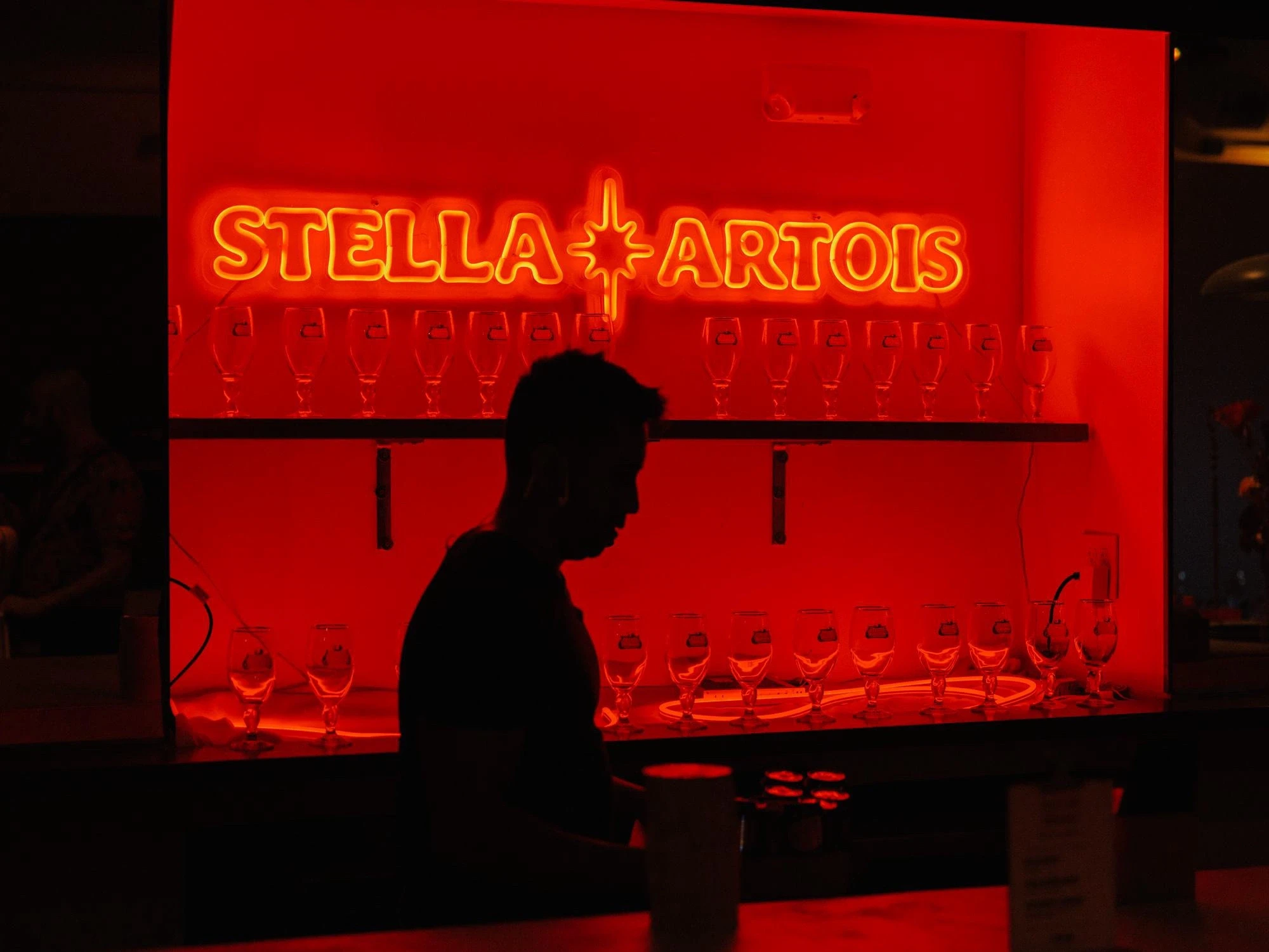 a dj mixing music in front of a crowd of people