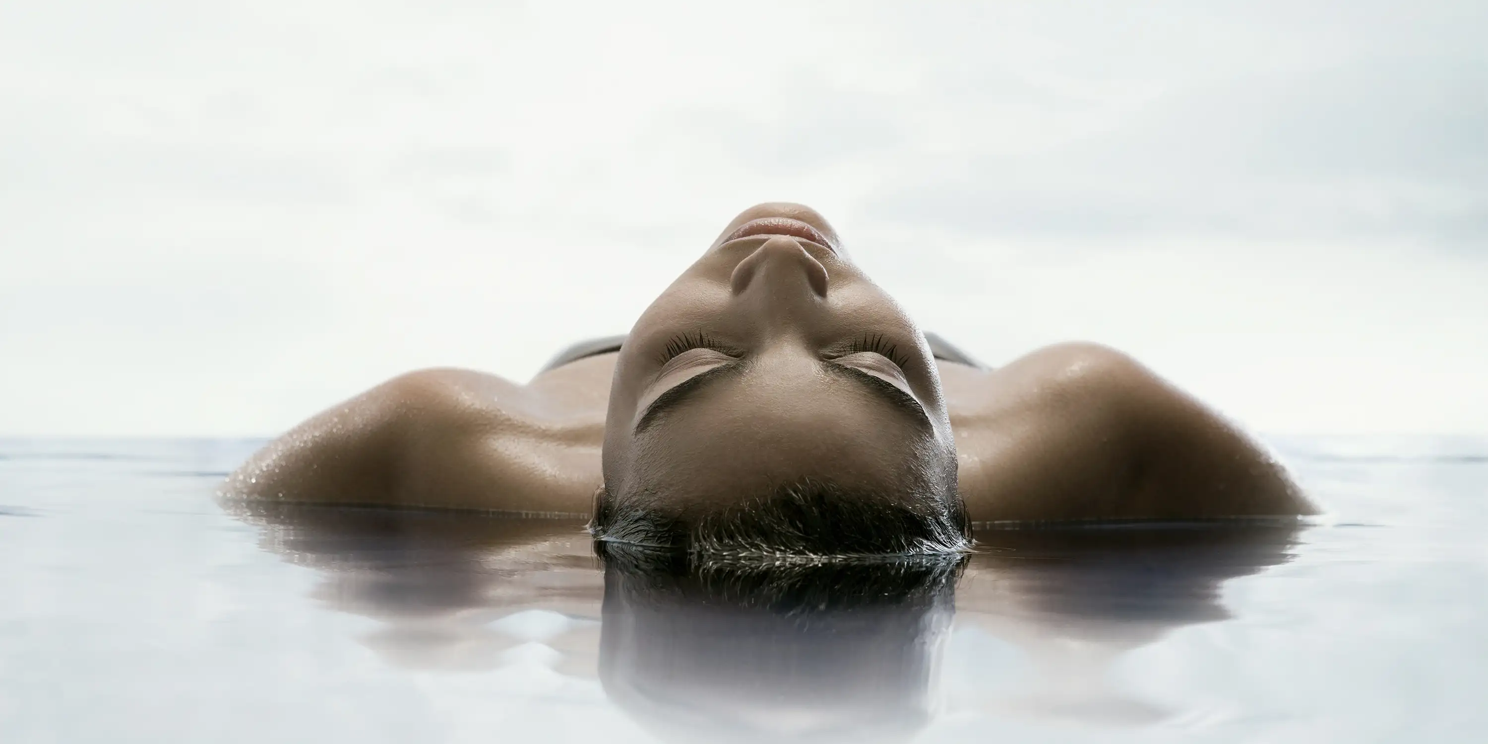 Person Floating In Etherial Water