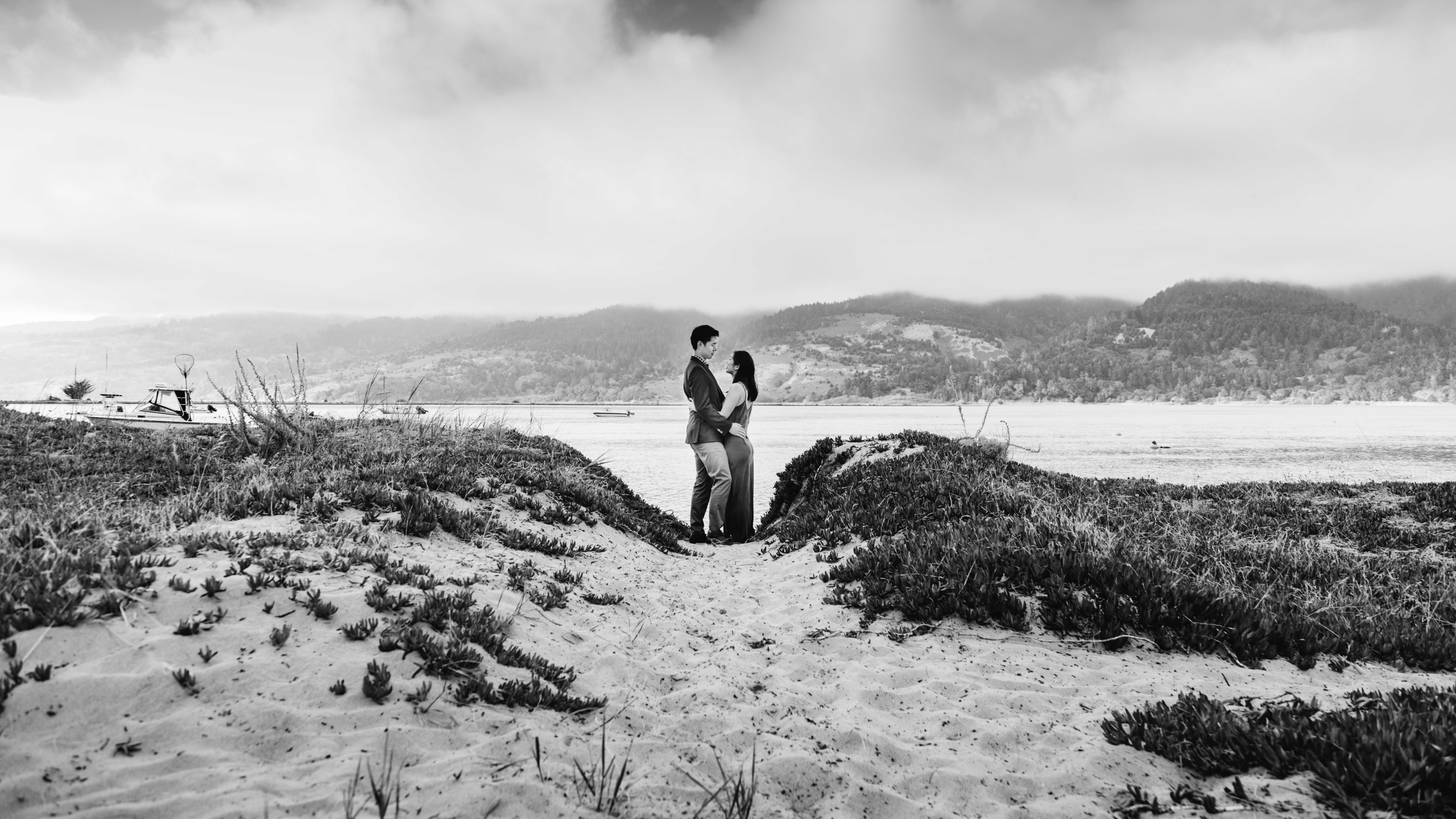 Couple on the shoreling looking in each others eyes